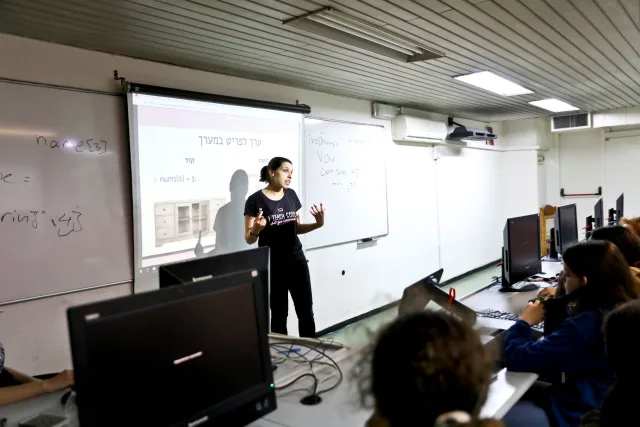 A QueenB instructor speaks during a session, March 17, 2019.