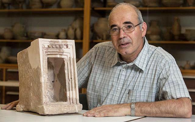 Yosef Garfinkel with a shrine model made of stone, found at Hirbet Qeiyafa