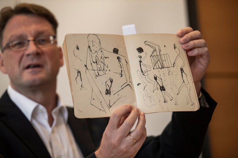 Stefan Litt, the curator of the National Library of Israel’s humanities collection, showing drawings by Kafka at a news conference in Jerusalem on Wednesday.