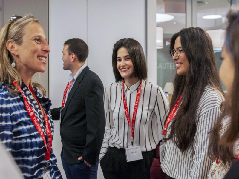 Hebrew University exchange students Noam Shapiro, right, and Shir Yadid are greeted at McGill University by Shawna Goodman Sone, chair of the Morris and Rosalind Goodman Foundation, left.