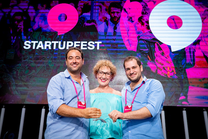 RenewSenses co-founders Prof. Amir Amedi and Tomer Behor accept the Grandmothers' Choice Award at Startupfest 2019 in Montreal.