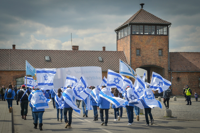 People from all over the world participating in the March of the Living at the Auschwitz-Birkenau camp site in Poland, as Israel marks annual Holocaust Memorial Day.
