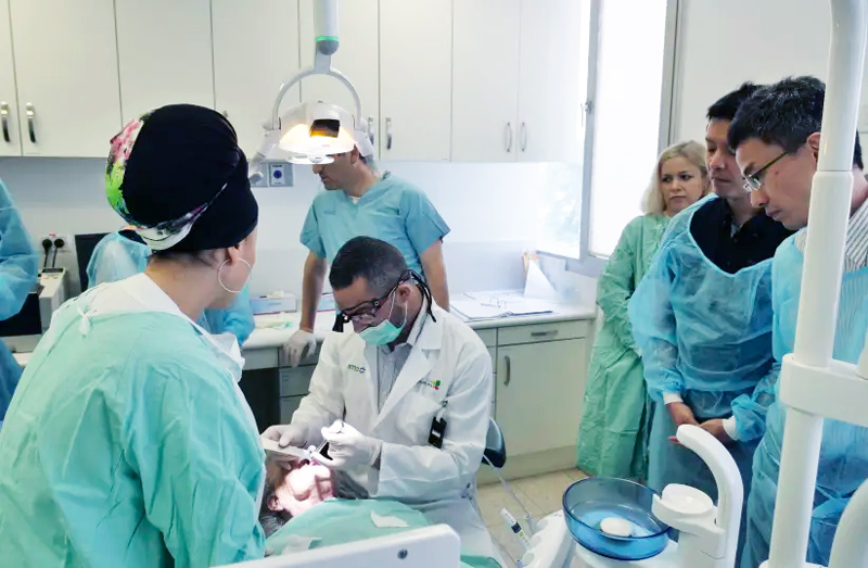 A medical team performing Alpha Tau treatment