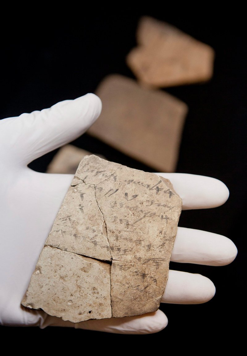 Writing on pottery, known as ostraca, unearthed in a fort in Arad, Israel, and dated to about 600 B.C.E., shortly before Nebuchadnezzar’s destruction of Jerusalem, are seen in Israel Museum in Jerusalem Tuesday, April 12, 2016. 