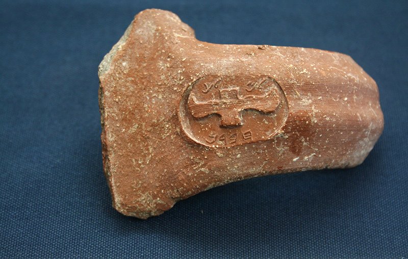 "LMLK" stamped vessel handle from Ramat Rahel; the inscription reads “to be sent to the king / belonging to the king, Hebron"