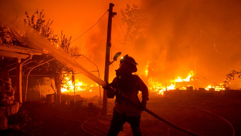 A fire fighter battling wildfires in California
