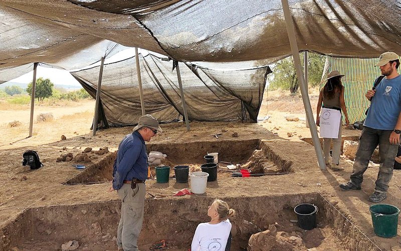 Archaeologist Aren Maeir left) supervises at an 830 BCE destruction layer at the Tell es-Safi/Gath Archaeological Project, July 2018.