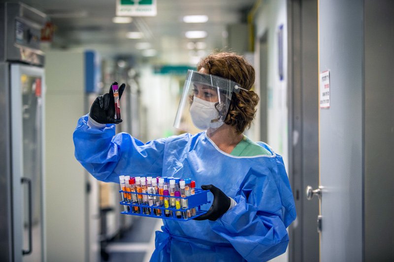 A technician carries out a diagnostic test for coronavirus in a lab at Ichilov Hospital in Tel Aviv on August 3, 2020.
