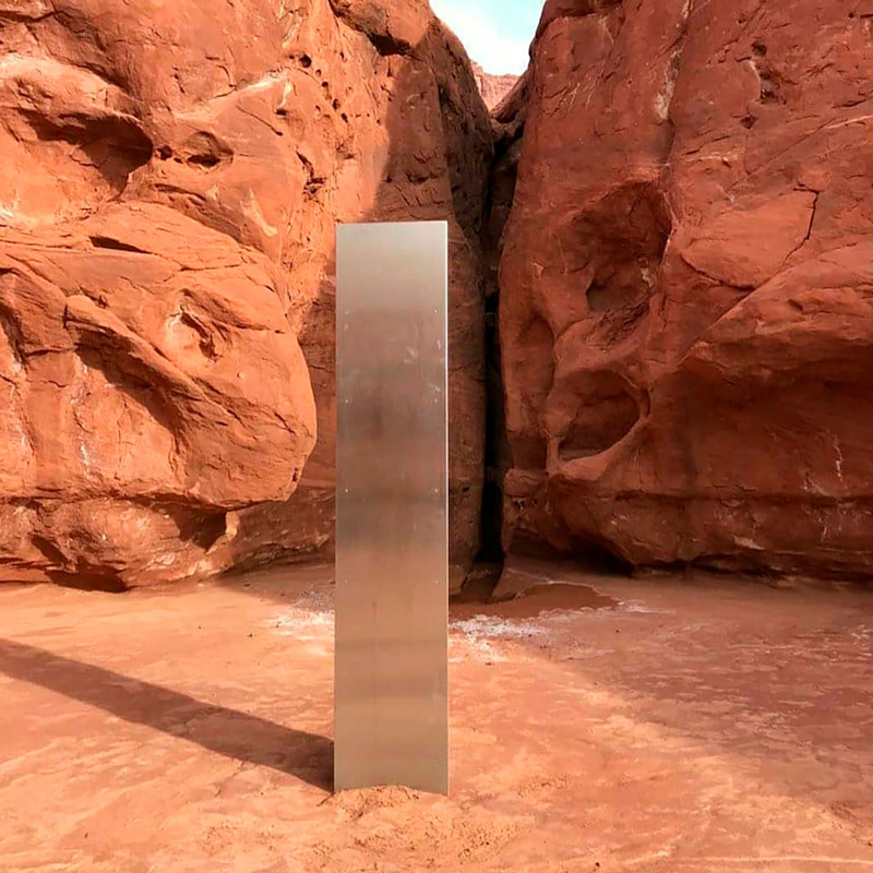 This Nov. 18, 2020 photo provided by the Utah Department of Public Safety shows a metal monolith installed in the ground in a remote area of red rock in Utah.