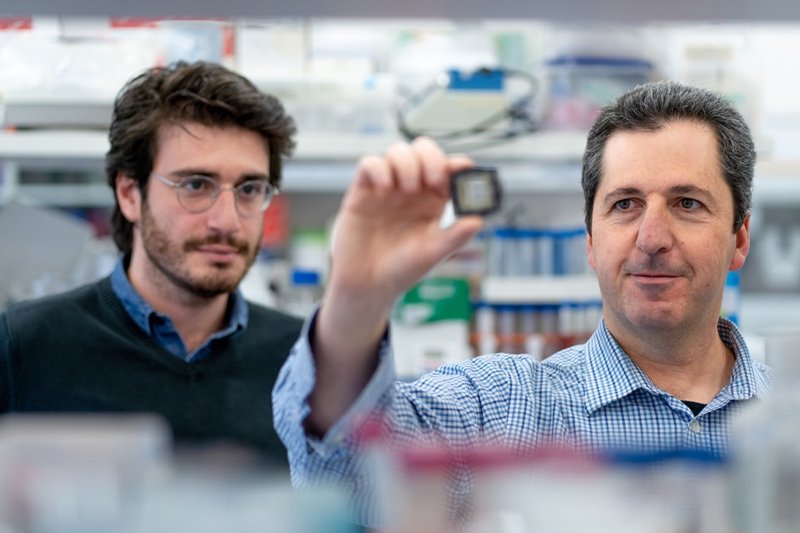 Prof. Yaakov Nahmias and Aaron Cohen with the organ-on-chip technology