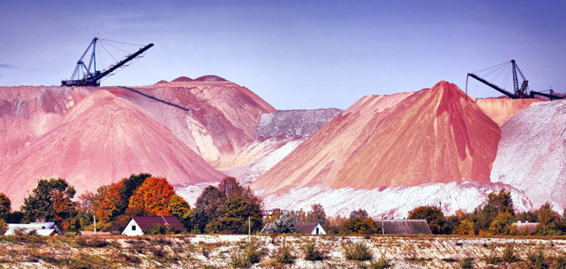 Mountains of red-colored salt from decades of potash mining at Soligorsk, in Belarus.