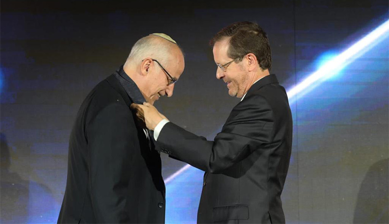 Prof Meir Buzaglo, a lecturer in the Department Of Philosophy, receives the Presidential Medal of Honor from Israel's President Isaac Herzog
