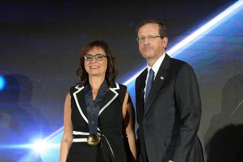 Prof. Mona Khoury, Vice President For Strategy And Diversity, receives the Presidential Medal of Honor from Israel's President Isaac Herzog